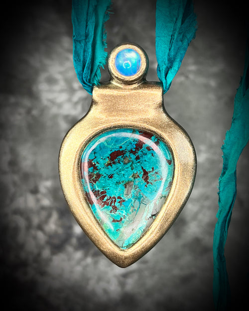 Turquoise Chrysocolla and Rainbow Moonstone crystal necklace, handmade with transformative teal recycled silk for sustainable jewelry lovers.