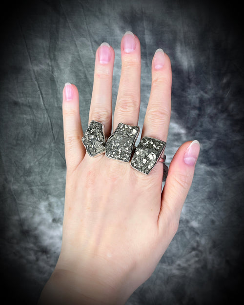 A sterling silver statement cocktail ring featuring a dazzling pyrite crystal.  Manifest your dreams and protect your energy with style.