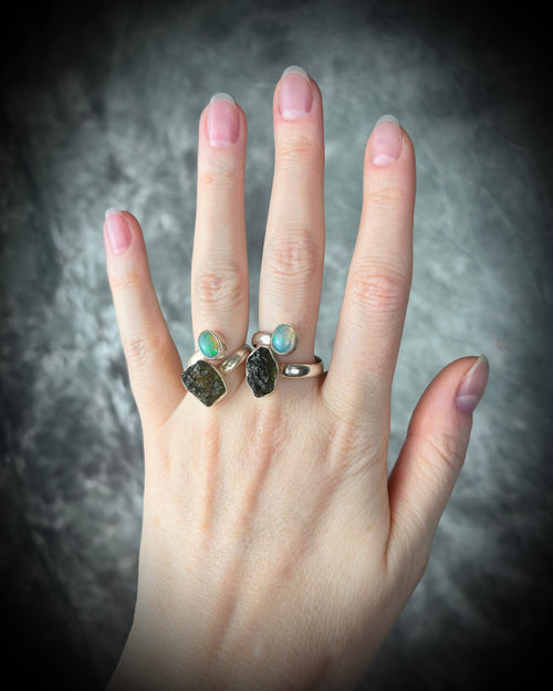 Raw stone adjustable statement rings in sterling silver featuring moldavite crystal and opal gemstone for spiritual elevation and crystal healing.  