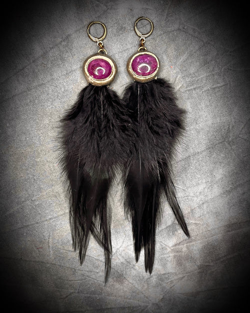 Stunning handmade ruby gemstone and black feather dangle earrings for her.  Rule like a queen in these maximalist boho earrings for vacations, festivals or a bold bride!