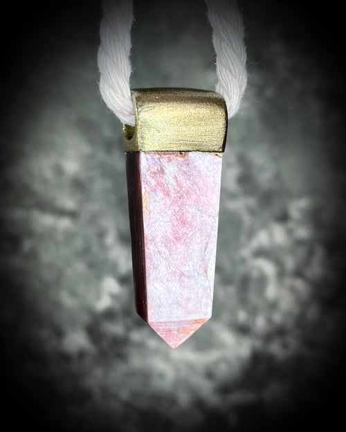 Handmade designer anti-anxiety crystal lepidolite point necklace in gold finish.  This gemstone pendant is hung from a cotton rope for an earthy and sustainable elegance. 