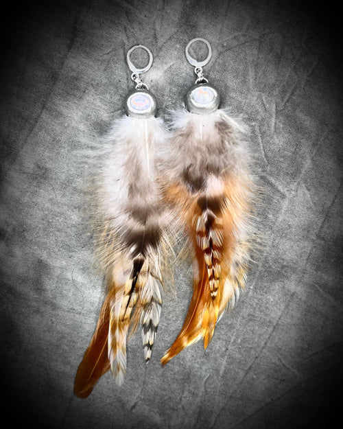 Mystical handmade moonstone crystal earrings for her.  Handmade natural ticked feather and moonstone dangle earrings on sterling silver hooks for festival, boho magic.