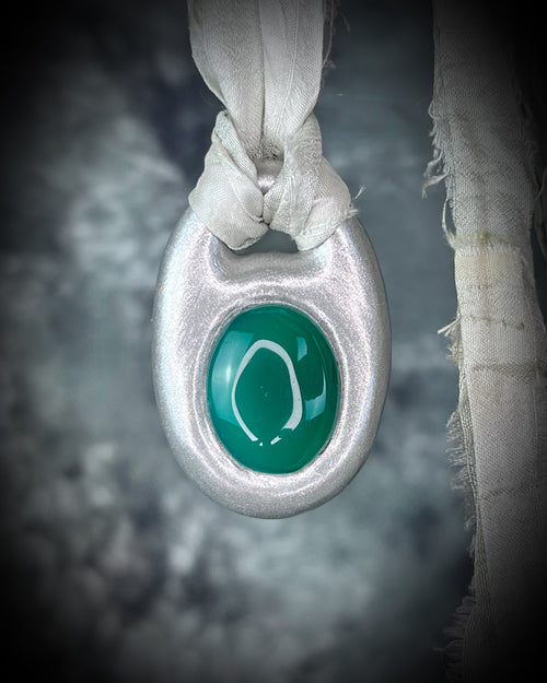 Green Onyx handmade silver necklace on recycled silk for heart chakra healing and luck.