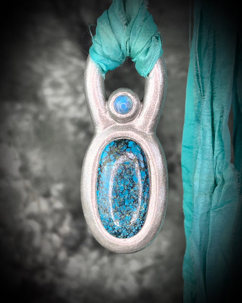 Handmade statement maximalist Turquoise and Moonstone chunky silver crystal jewelry on aqua recycled silk for a vintage jewelry appeal.